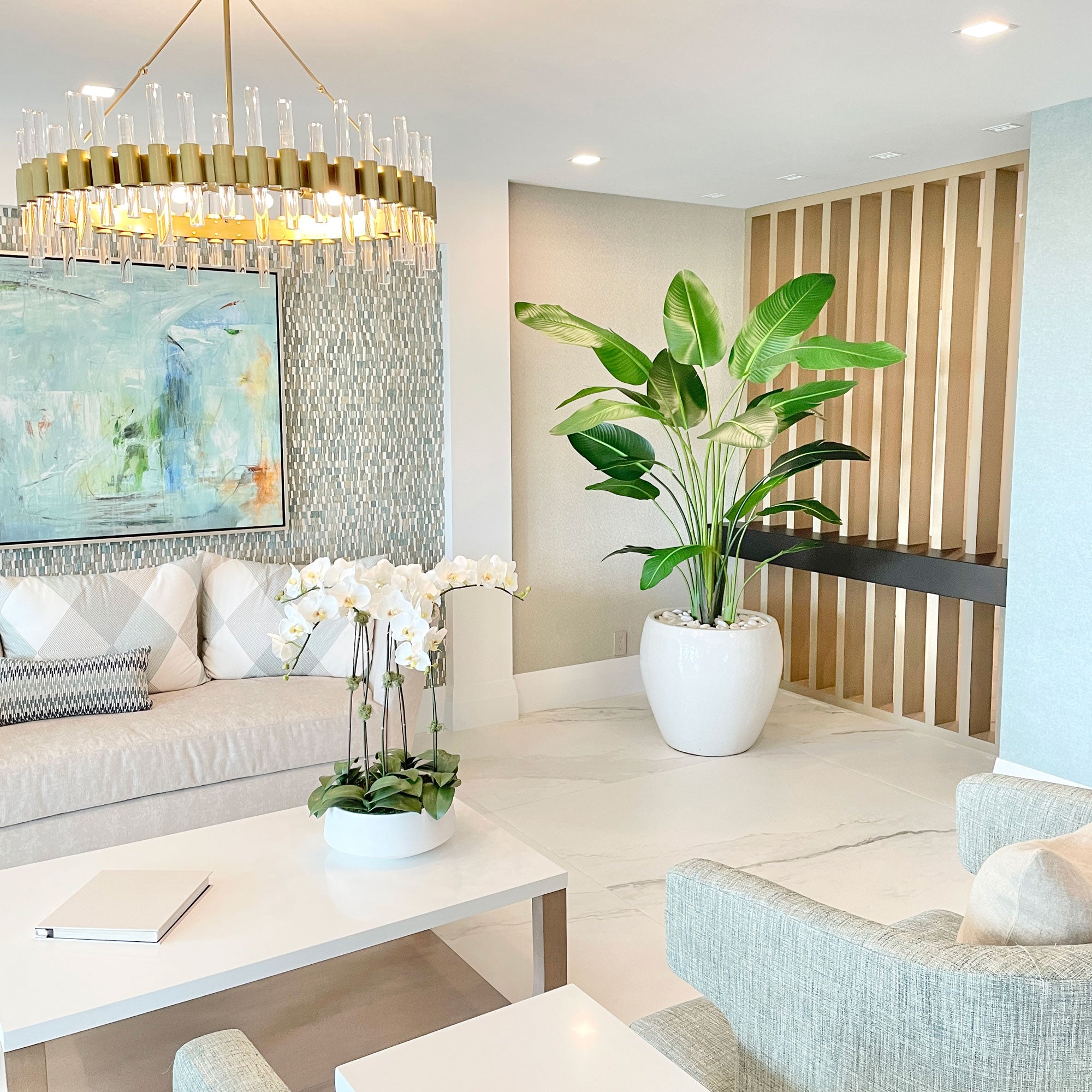 a 7' tall faux travellers palm tree in a condo lobby in Delray beach